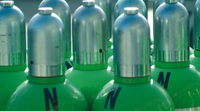 Steel cylinders (colour green) and letter 'N'. View of the cylinder tops with caps.